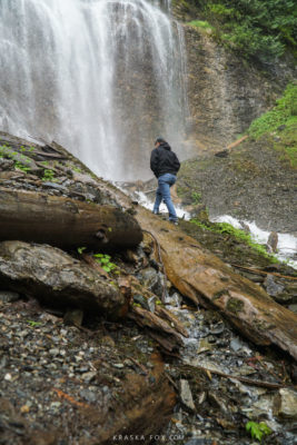 Rob climbing the slippery rocks up to the base of the falls.