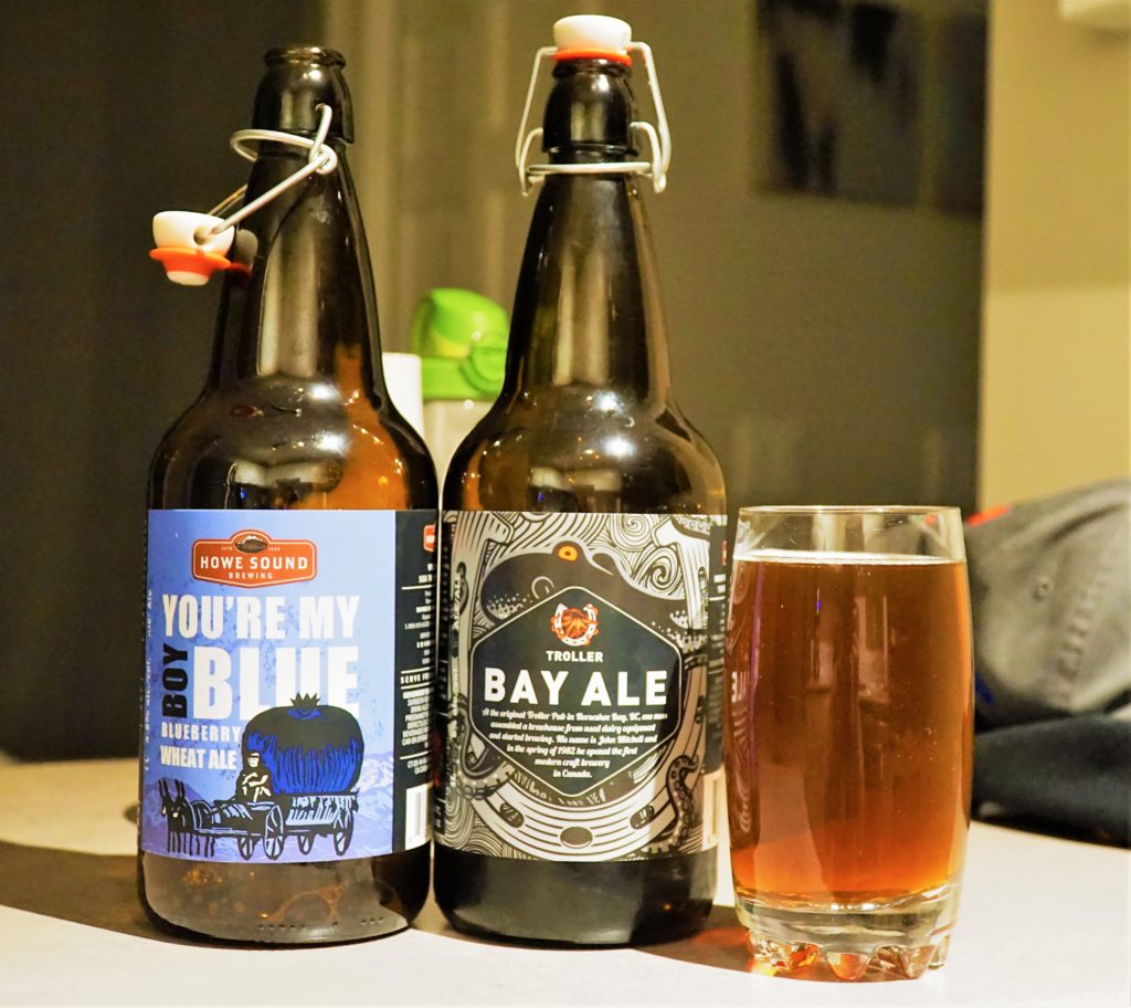 Local Craft Brews from Howe sound brewery - Two Beers on a table with a glass beside them filled up.