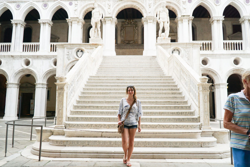 In front of some beautiful steps in Doge's Palace in Venice, Italy - Kraska Fox