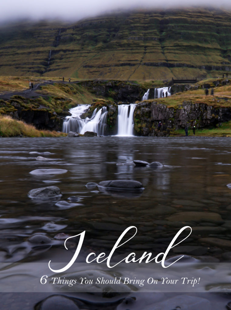 Beautiful Kirkjufellsfoss in the distance and black stones in the background.